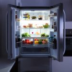 Open,refrigerator,full,of,juice,and,fresh,vegetables,in,kitchen